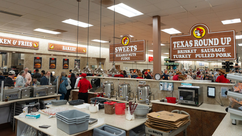 Interior of a crowded Buc-ee's favoring several serving stations