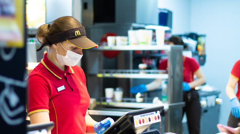 A cashier at a McDonald's location