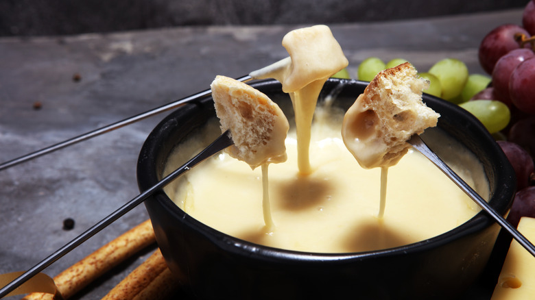 bread dipped into fondue