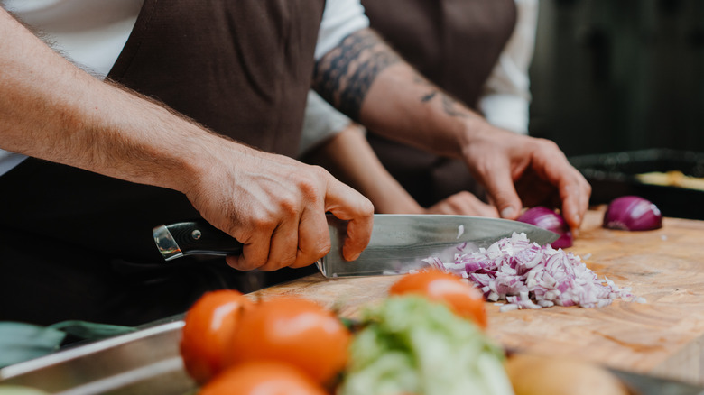 Chef cutting onions
