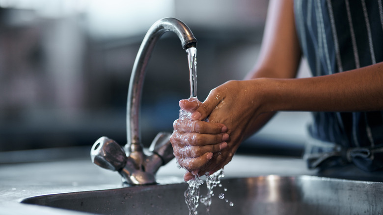 Person washing their hands