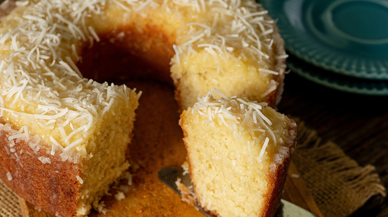 Coconut cake with slice removed