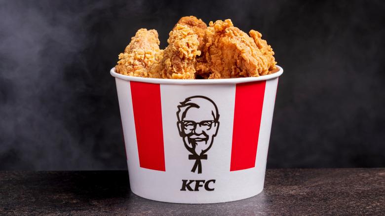 A red and white KFC bucket of golden fried chicken