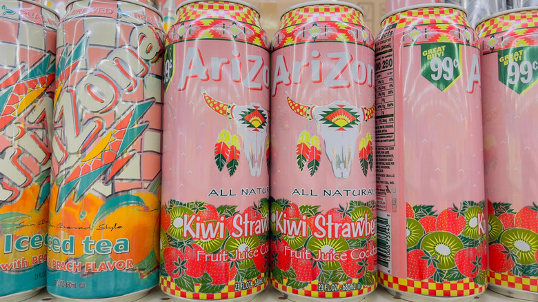 AriZona iced tea cans stamped with 99 cents on a shelf