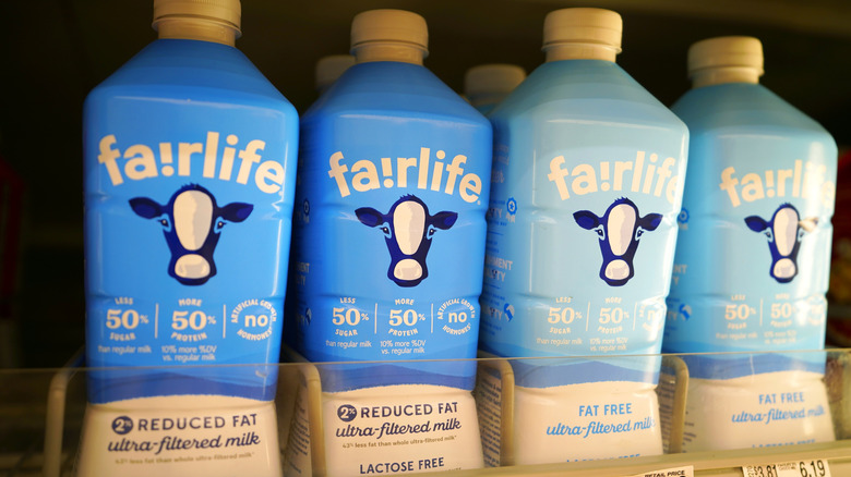Bottles of Fairlife milk on a grocery store shelf
