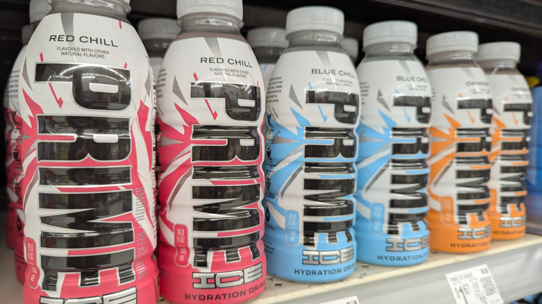 Bottles of Prime Hydration lined up on a grocery store shelf.
