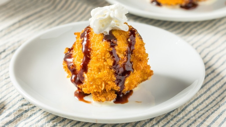 fried ice cream with whipped cream and chocolate syrup