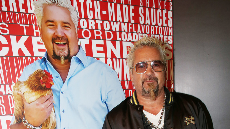 Guy Fieri with Guy Fieri poster