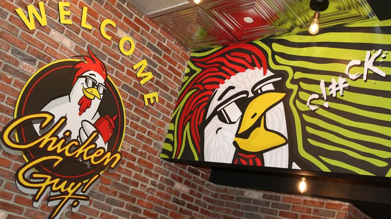 The Chicken Guy logo inside Guy Fieri's restaurant