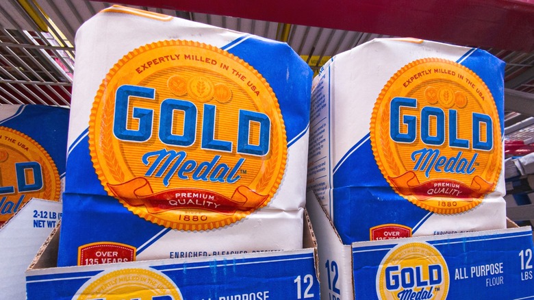 Paper bags of Gold flour for sale in a supermarket.