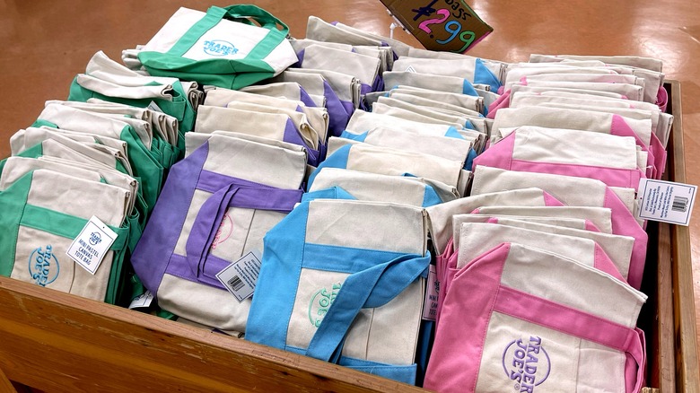 A bin full of Trader Joe's mini canvas totes