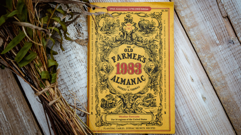 A 1983 edition of The Old Farmer's Almanac against a wooden backgound