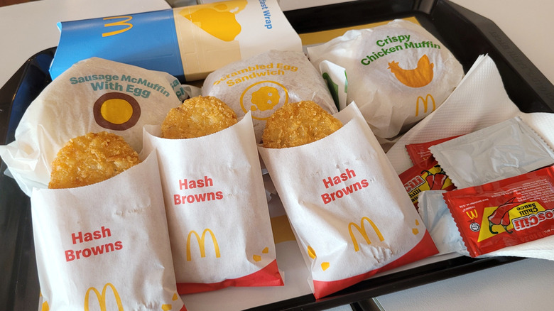 McDonald's hash browns on tray with full meals