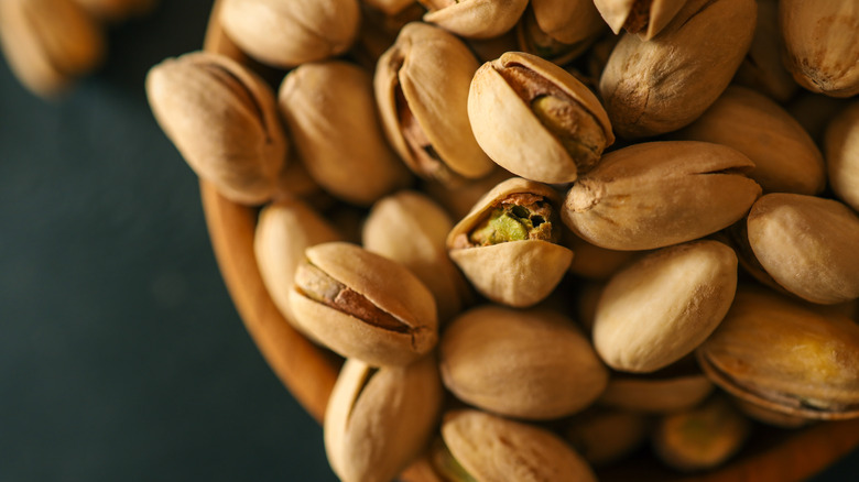 Wood bowl filled with pistachios