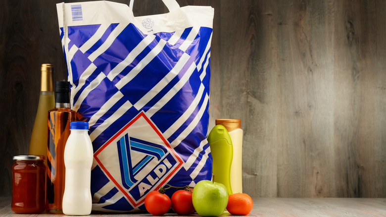 Aldi reusable plastic bag surrounded by groceries