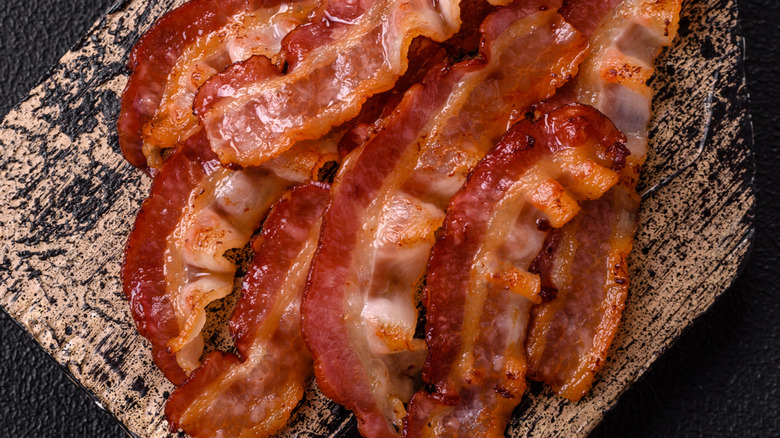 Crispy bacon rashers on a board