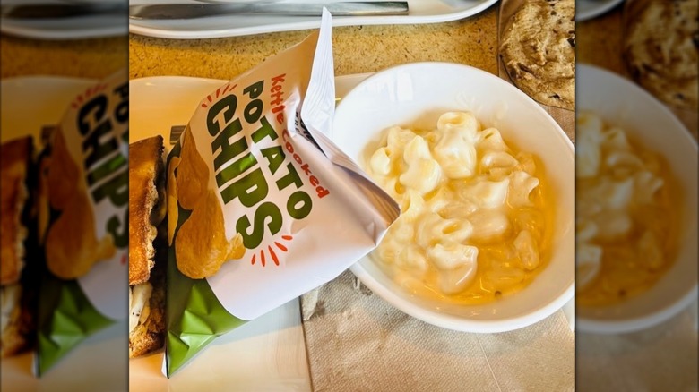 Bowl of Panera Bread mac and cheese and a bag of kettle cooked potato chips