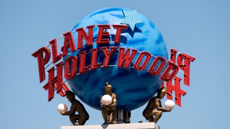 Planet Hollywood globe statue against sky