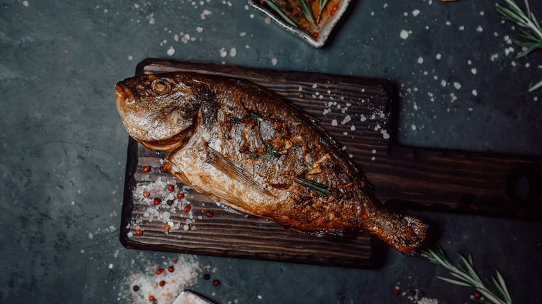 fish on wooden cutting board
