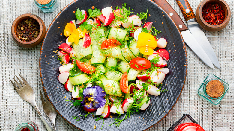 A salad garnished with edible flowers