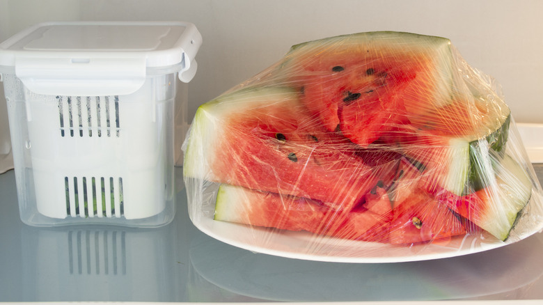 Watermelon stored in plastic wrap in the refrigerator