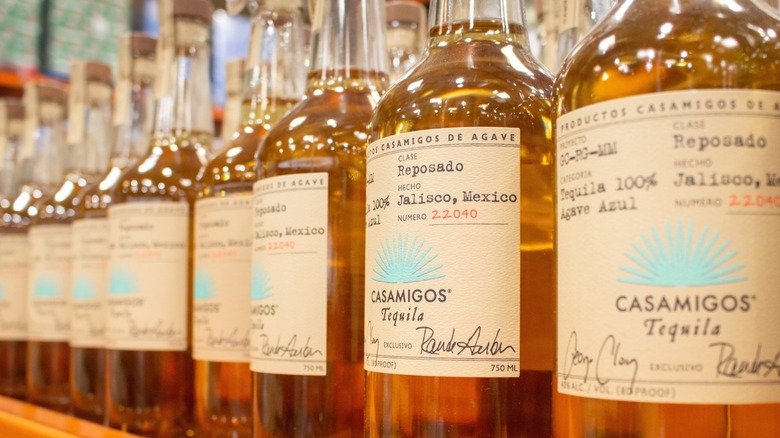 Bottles of George Clooney's Casamigos Tequila on a shelf.