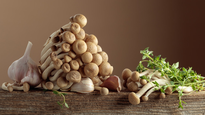 Mushrooms and garlic on wood