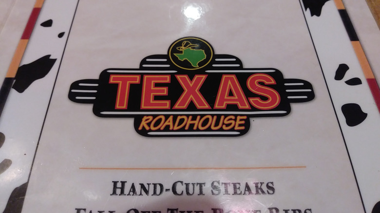 The Texas Roadhouse logo on the front of a menu.