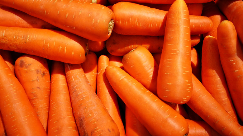 Huge carrots stacked on top of one another