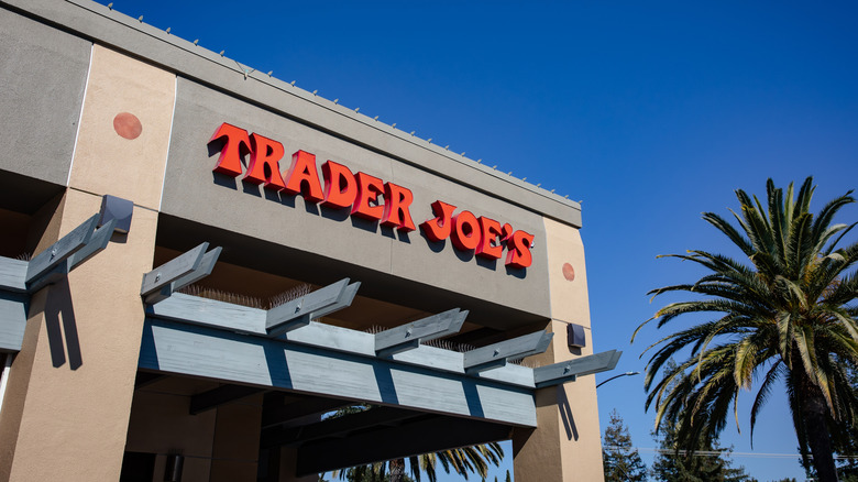 Trader Joe's storefront with a palm tree nearby.