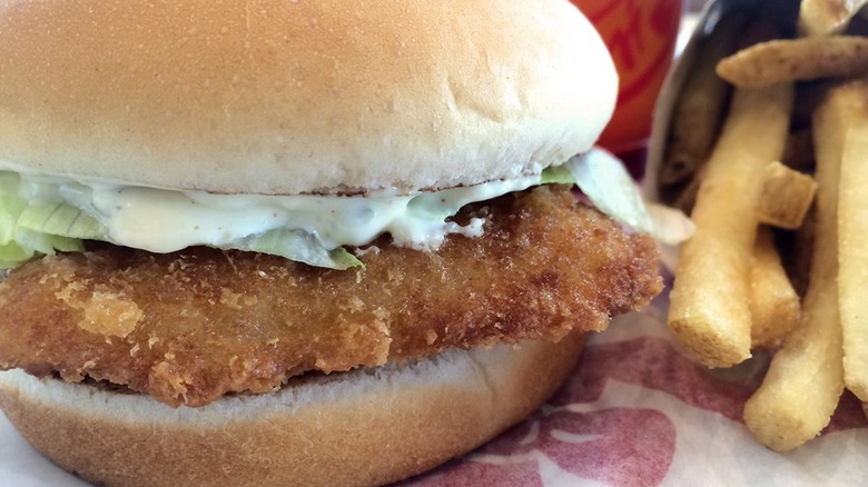 A Wendy's fish sandwich served with fries.