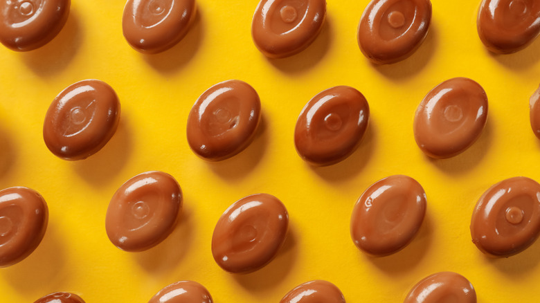 Werther's Original caramel candies on a yellow background