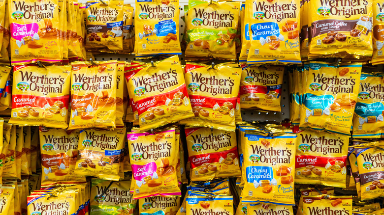 A variety of Werther's Original candy flavors hang in a store.