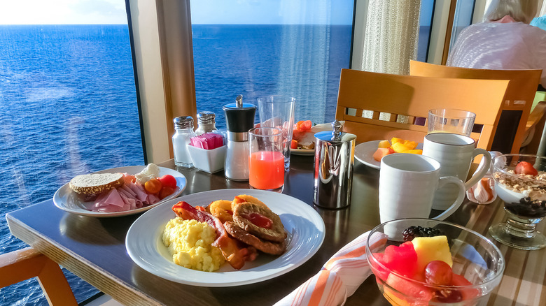 Cruise ship breakfast foods on a table overlooking the ocean