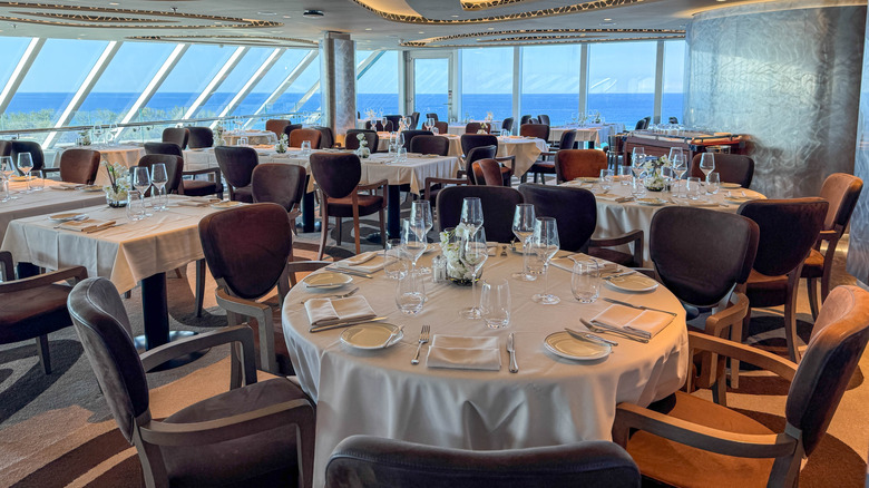Cruise ship dining room with tables ready for diners