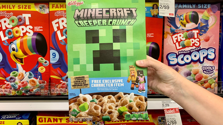 A minecraft creeper crunch cereal box in a grocery store aisle, offering a free exclusive character item