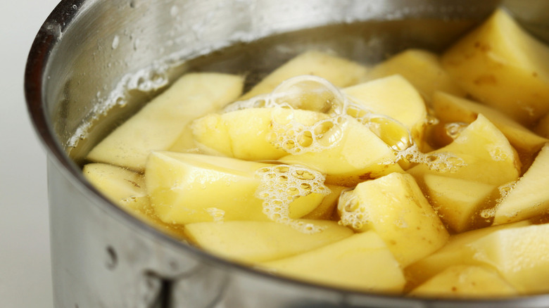 potato chunks in a pot of water