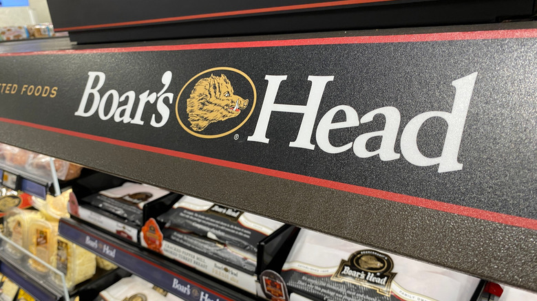 The Boar's Head logo emblazoned over a deli section of a grocery store.