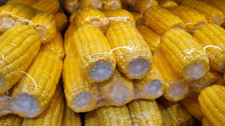 Pre-shucked corn in plastic packaging.