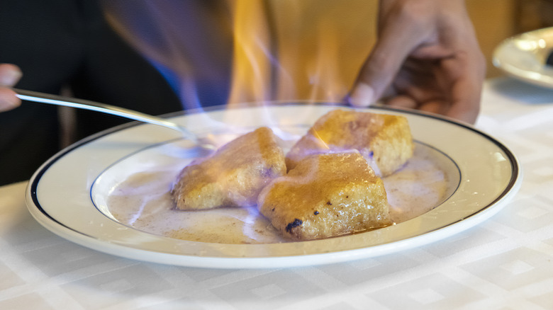 Flambéed dish on a restaurant plate