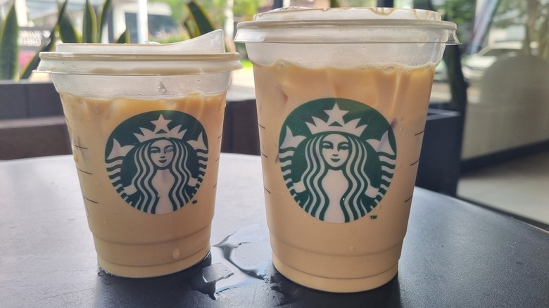Two Starbucks iced lattes on table