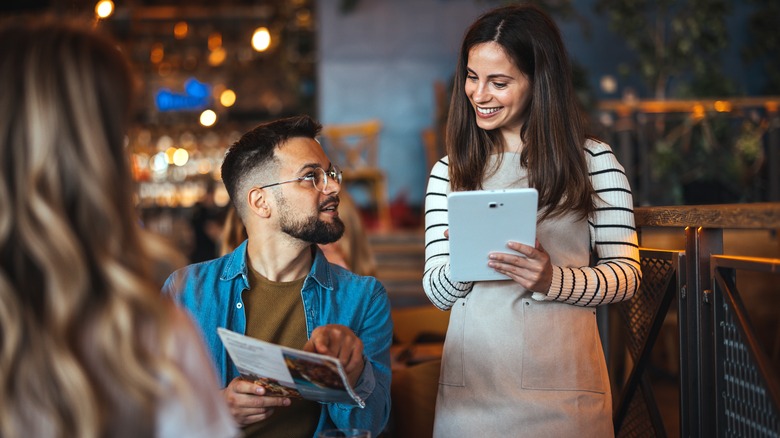 A person ordering at a restaurant