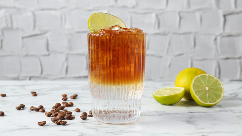 Sparkling water with espresso and lime wheel