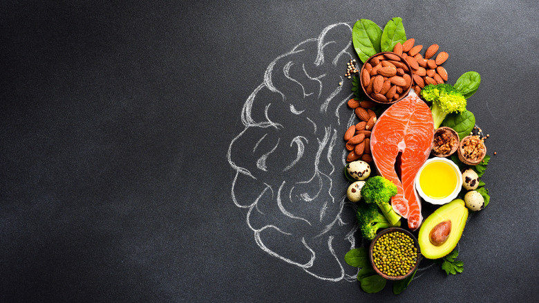 Drawing of a brain with some avocado, salmon, nuts, and broccoli