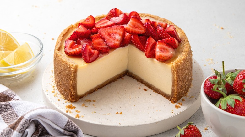 A cheesecake topped with strawberries