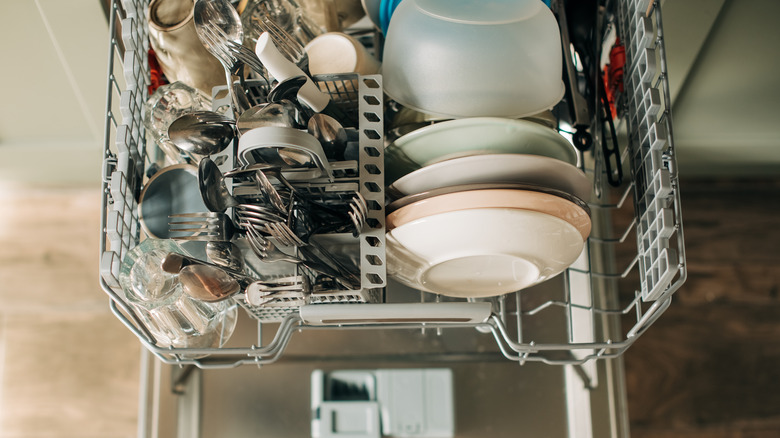 Aerial view of dishwasher rack pulled out filled with clean dishes