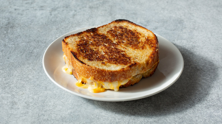 A crispy grilled cheese sandwich on sourdough bread