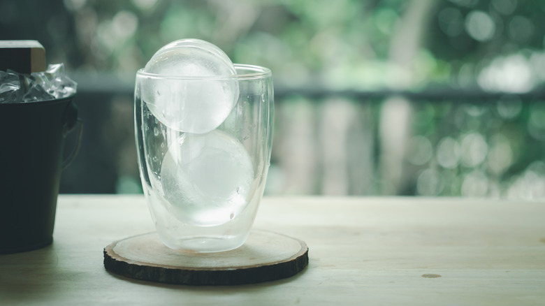 Round ice cubes in a glass