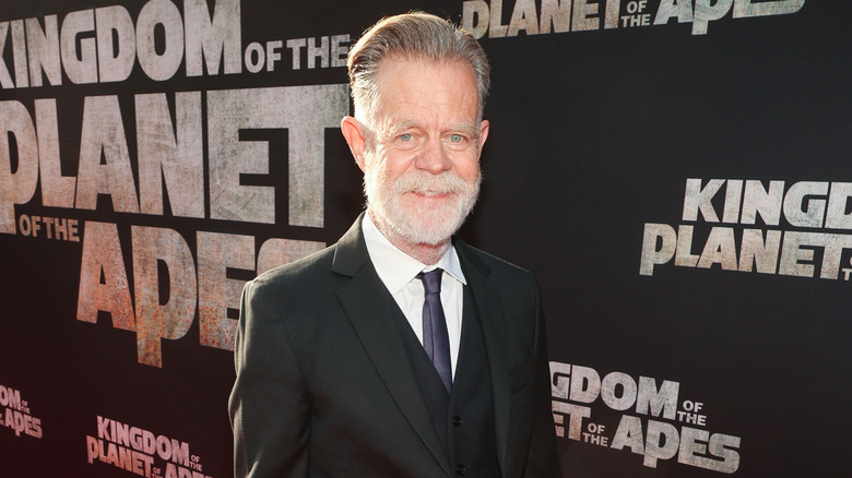 Bearded William H. Macy in a black suit at the premiere of Kingdom of the Planet of the Apes
