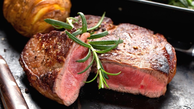 A rare steak on a plate.
